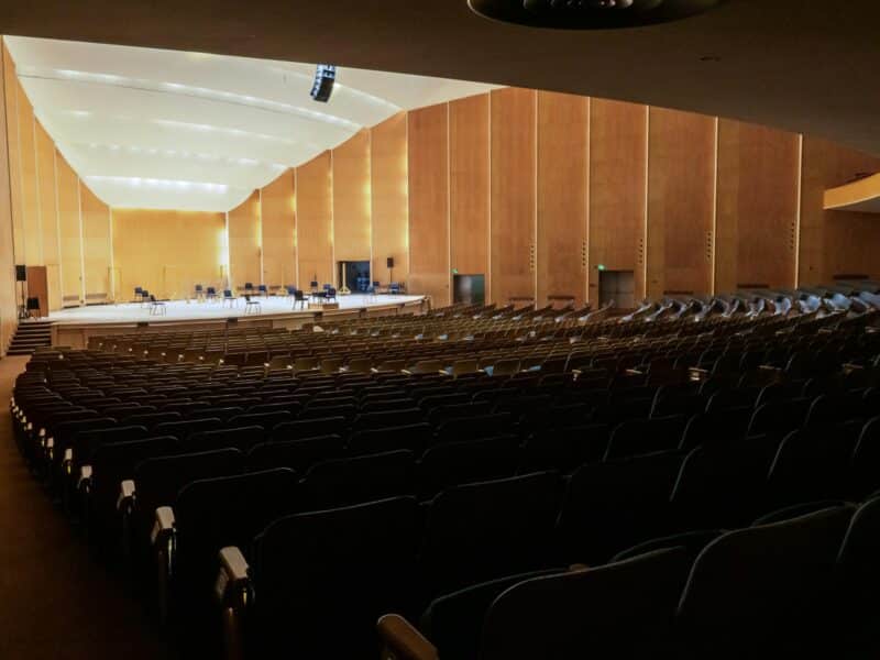 a large auditorium with rows of empty seats